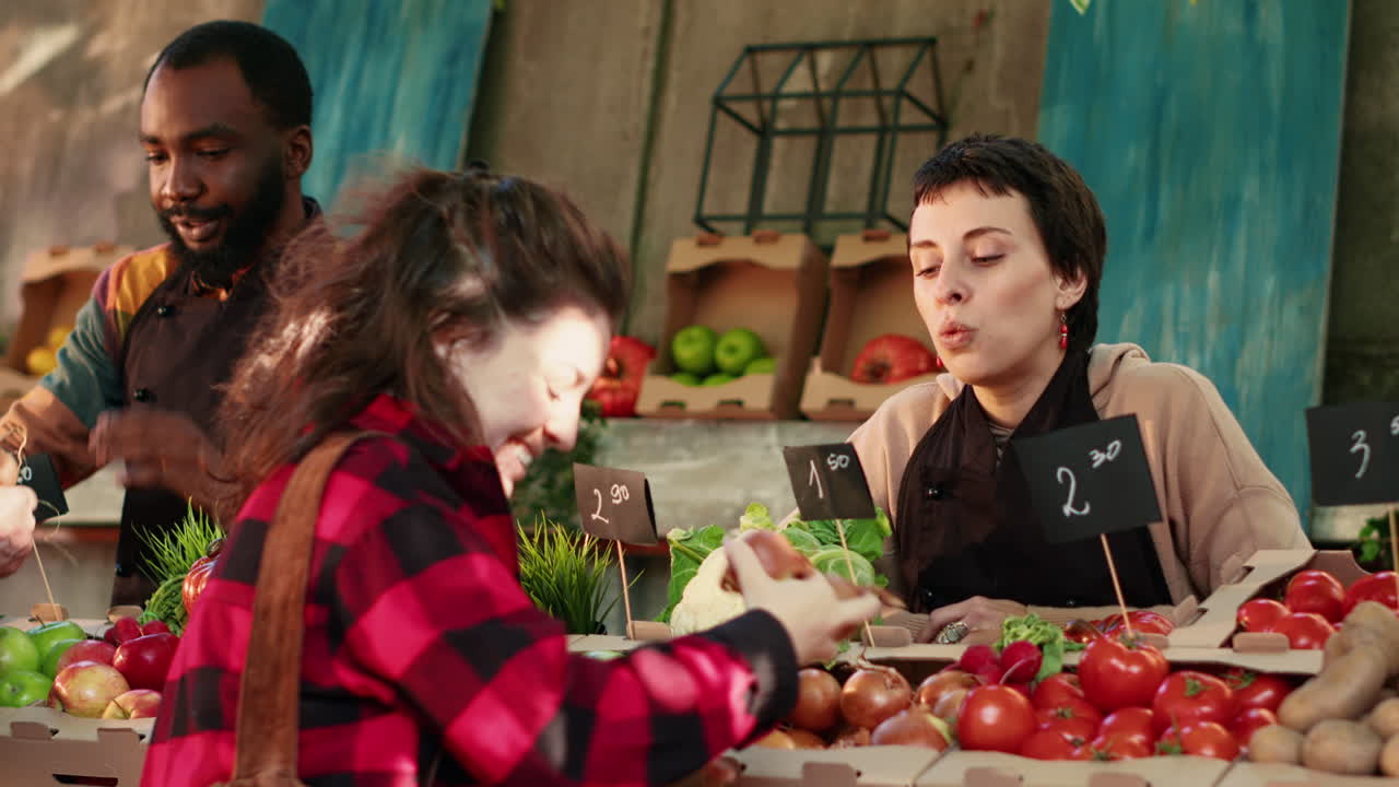 People shopping for produce at an outdoor market
