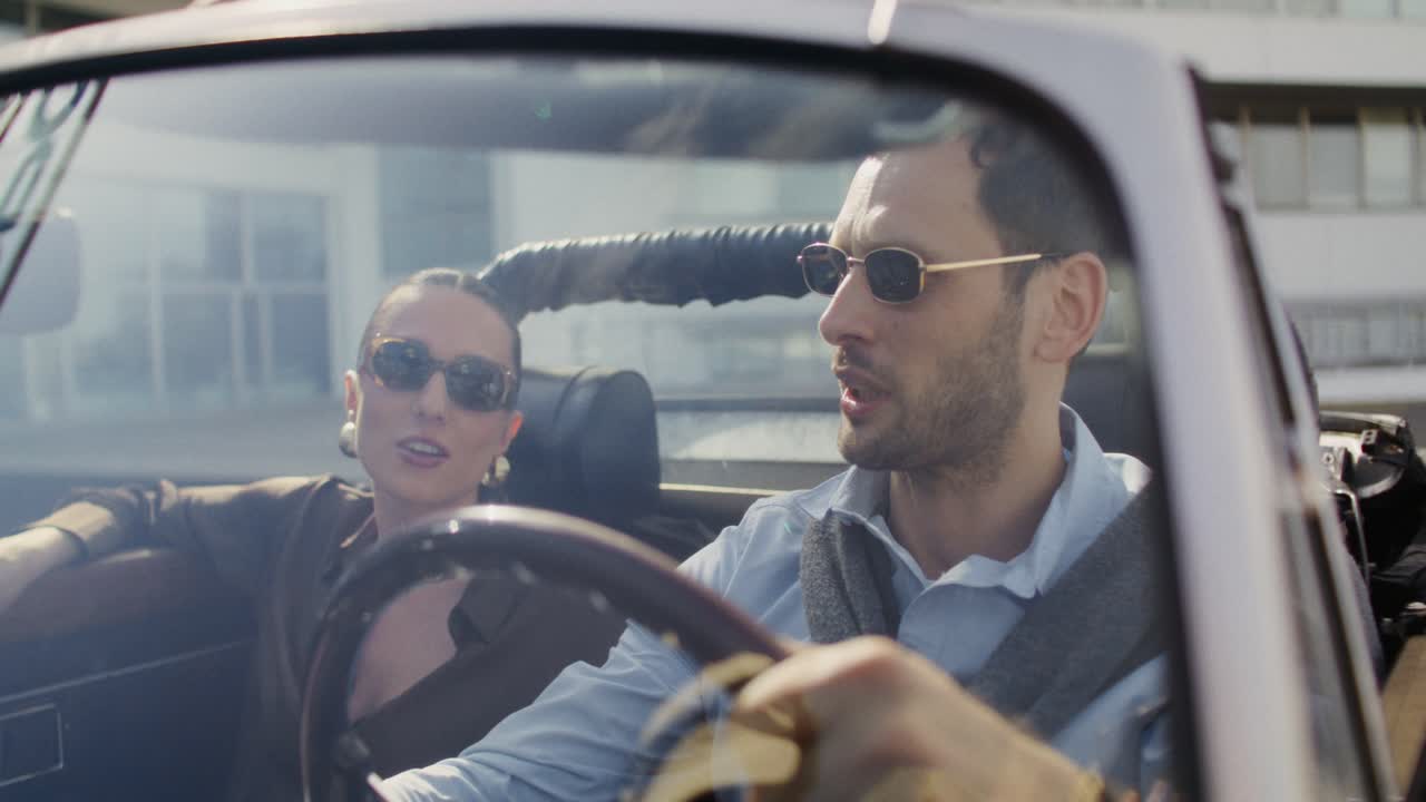 Couple Enjoying a Drive in a Classic Convertible
