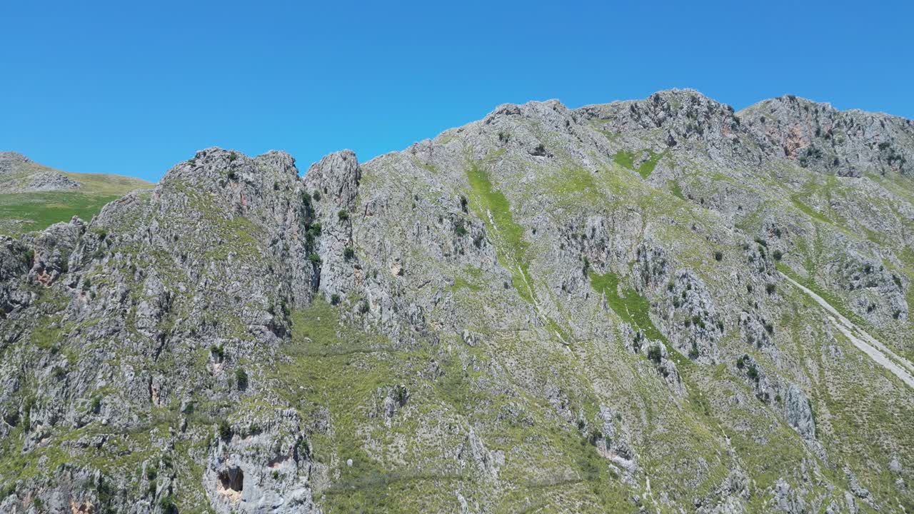 Aerial drone footage of Alcara Li Fusi, Sicily: mountain village, rocky peaks, lush valleys and wild Nebrodi landscapes. Ideal for travel, nature and scenic stock footage