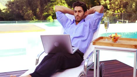 Handsome-man-using-laptop-and-relaxing