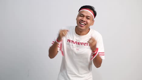 wow excited asian man with red white ribbon. good news in indonesia independence day
