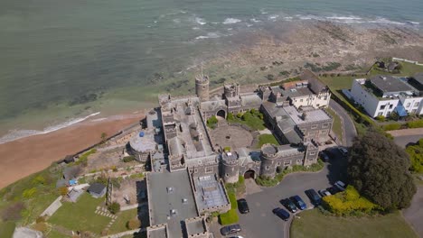 kingsgate castle kent seaside english chalk cliff coastal bay landmark aerial view slow birdseye flyover