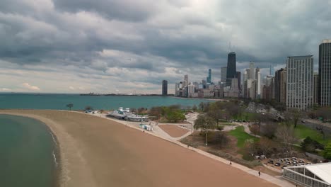 aerial ascent pan of chicago city skyline southbound, chicago, illinois - drone 4k