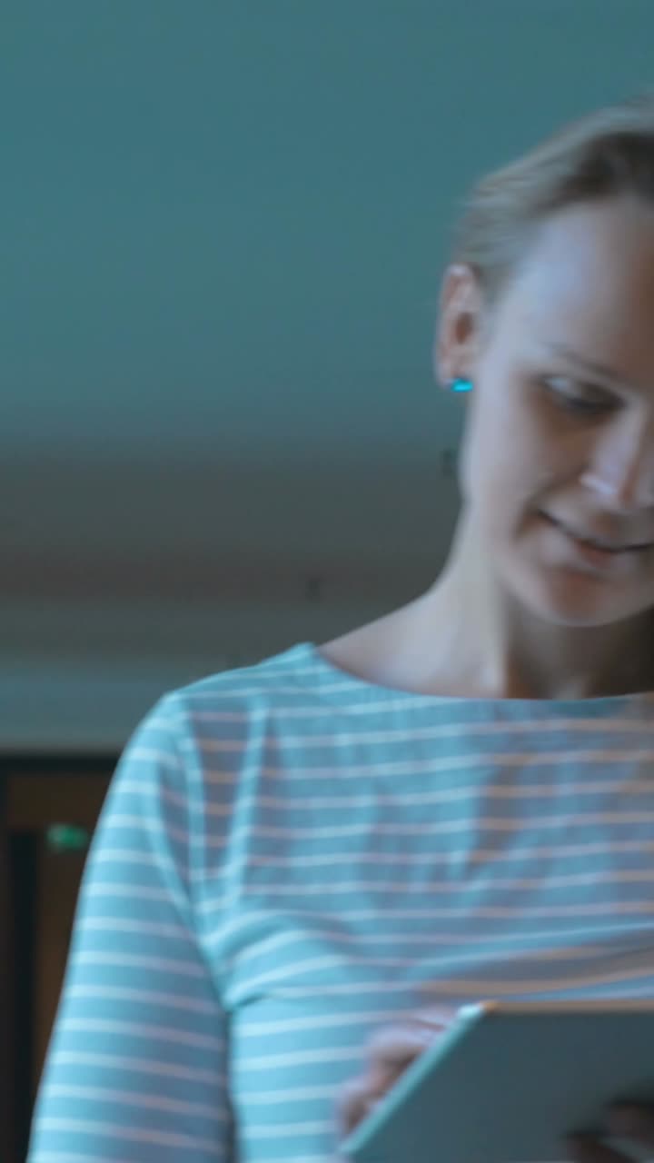 Woman using a tablet indoors