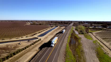 trucks on highway near san joaquin river near modesto california