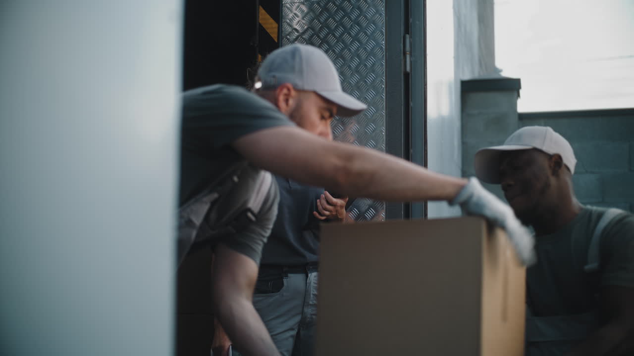 A delivery team manages packages and logistics from a truck