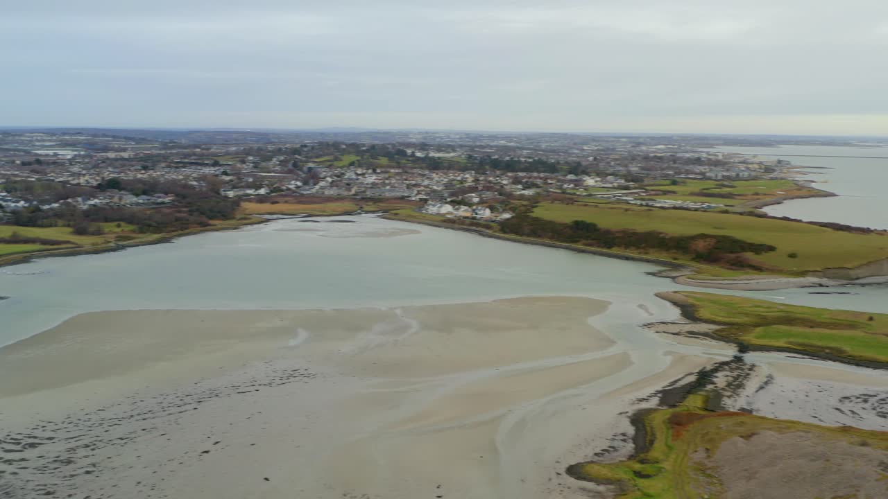 Vast aerial establishing shot of Galway with Rusheen Bay in the foreground, Ireland