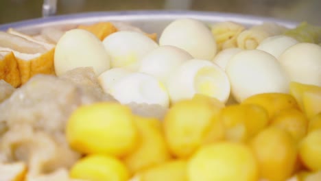 steamed food called siomay - potatoes, tofu and eggs steaming in a steam pot