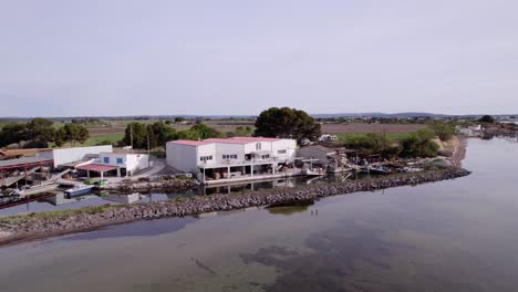 Rotating-aerial-of-coastal-house-during-sunshine-day,-location-Sète,-south-of-France