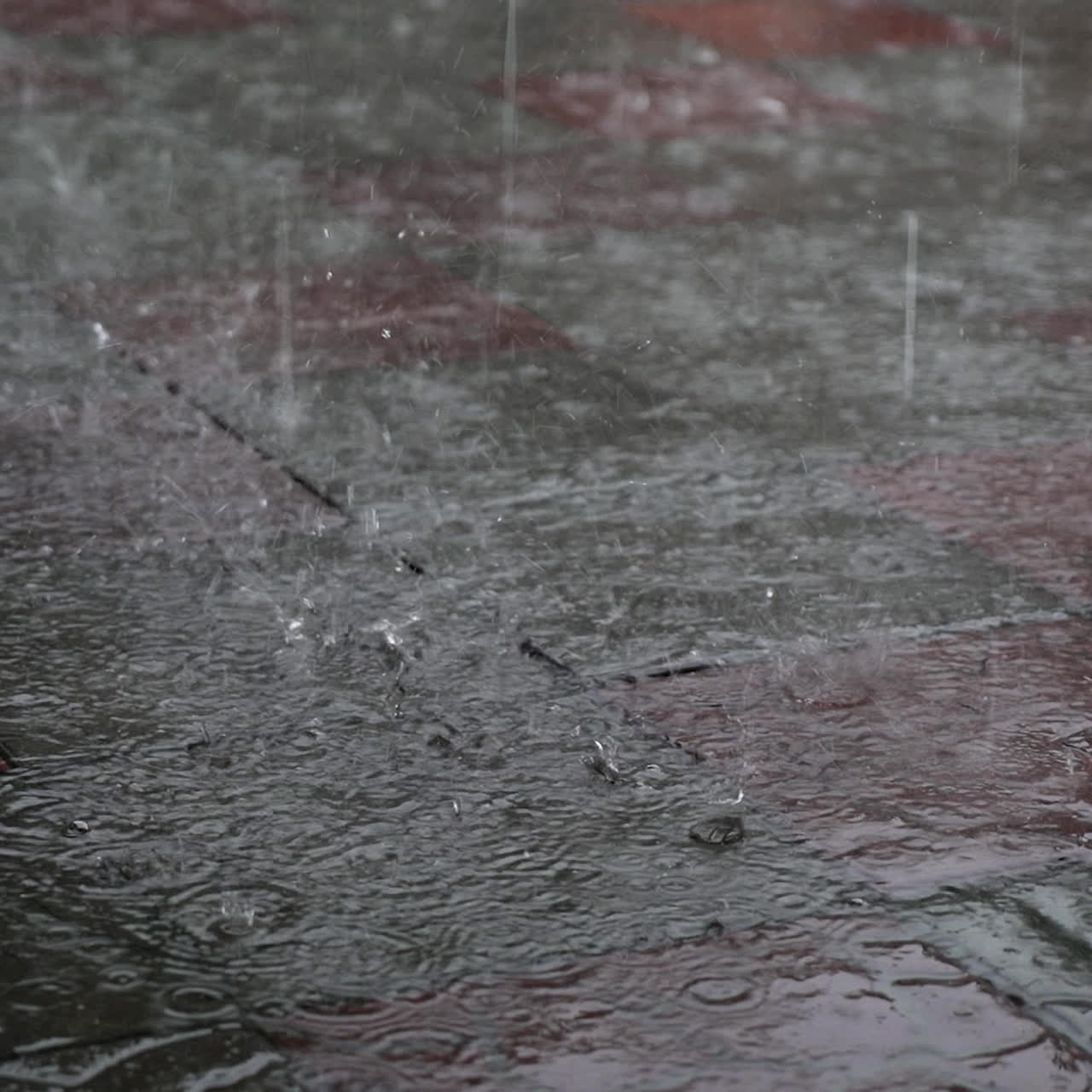 Rainy Day. Drops of heavy rainfall on the asphalt.