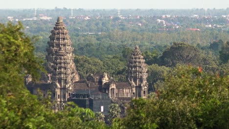 angkor wat temple behind the trees