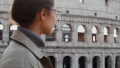 woman visiting the colosseum in rome