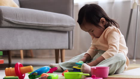 asian baby in living room