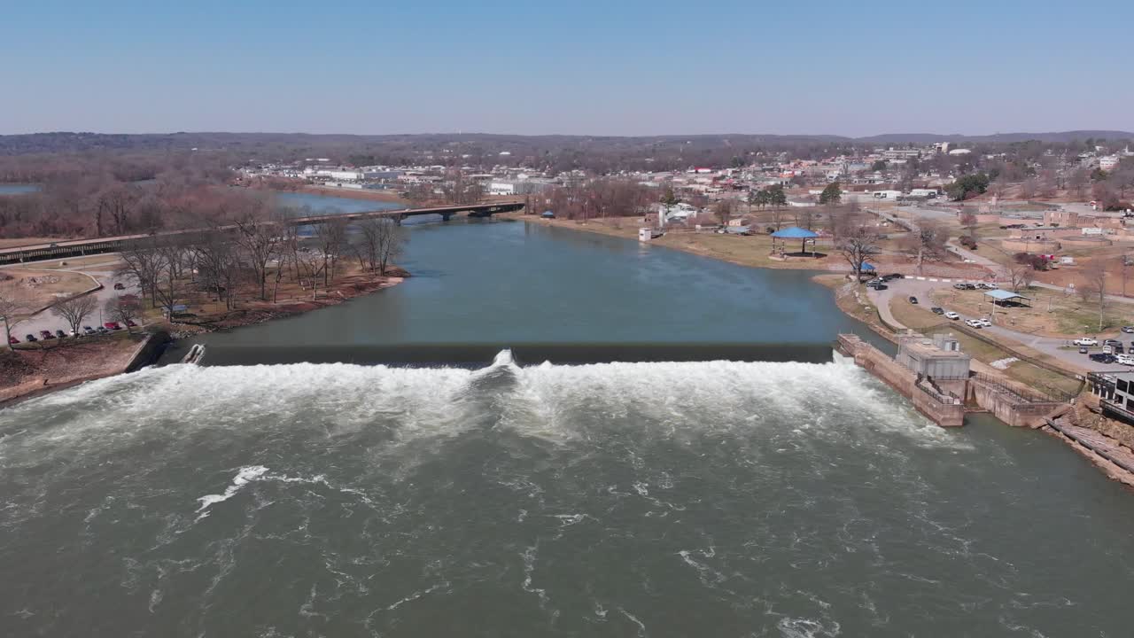 Aerial view around a Hydroelectric power plant, in sunny Arkansas, USA - orbit, drone shot