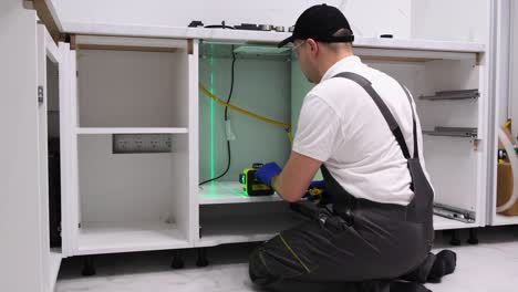 kitchen cabinets installation young male worker assembling furniture