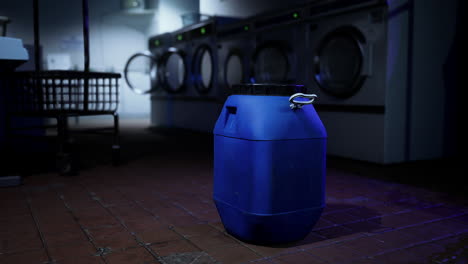 a blue plastic container in a laundry room