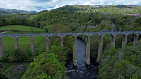 aerial view pontcysyllte aqueduct and river dee canal narrow boat bride in chirk welsh valley countryside push in forwards