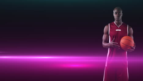 animation of african american male basketball player holding ball on dark background with pink light