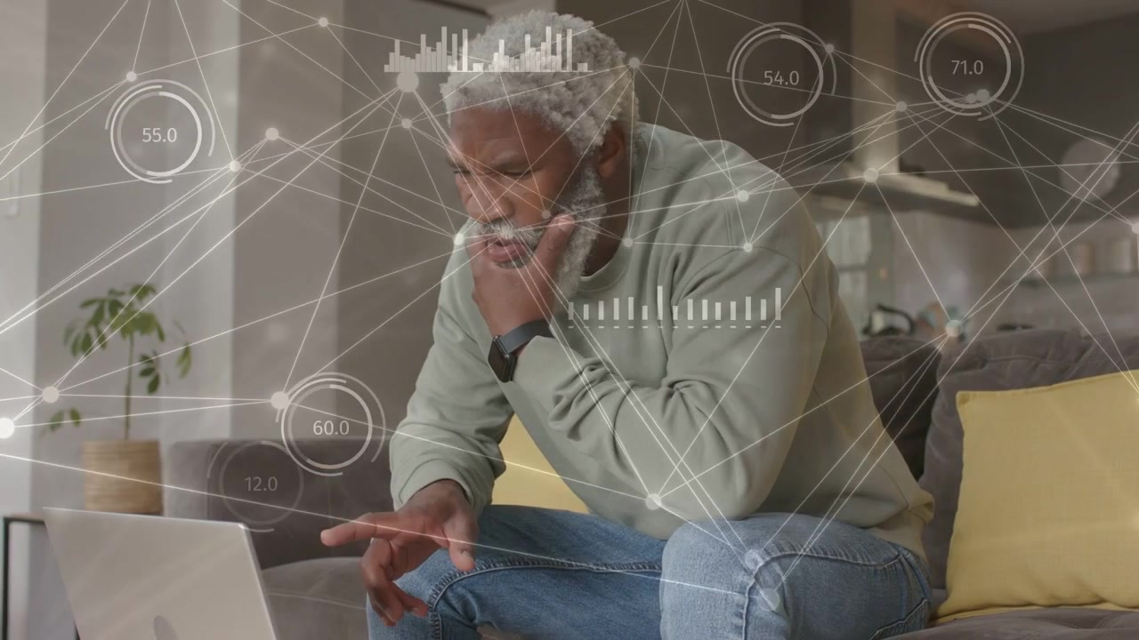 Man studying laptop screen and interacting with trackpad, HUD analytics appearing for data analysis