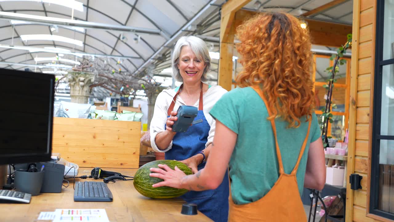Customer buying melon at plant shop
