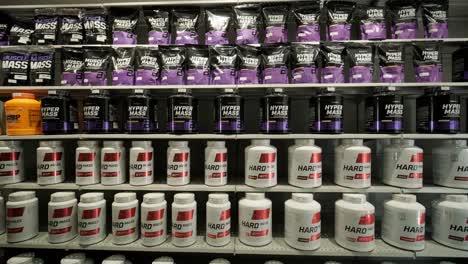 sport nutrition store interior with large choice of nutritional supplements.