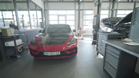 cars undergoing maintenance in auto repair shop