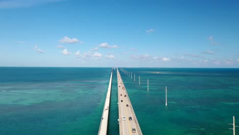 vehicles driving on seven mile bridge across florida keys in monroe county, florida