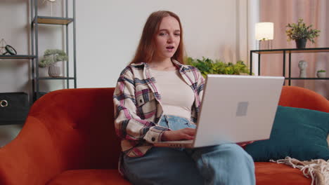 sad young woman use laptop computer pc browsing, loses becoming surprised sudden bad lottery results