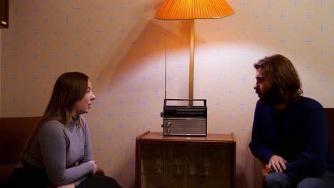 couple listening to a retro radio