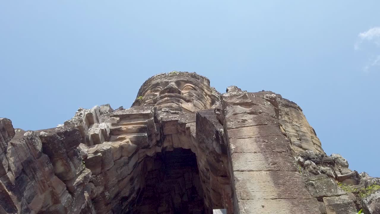 Giant Stone Faces of Bayon Temple in Angkor Wat, Cambodia
