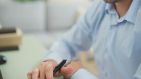 Shot-of-Man-Using-Calculator