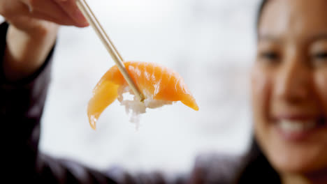 woman having sushi in restaurant 4k