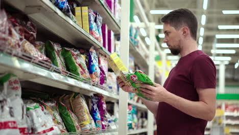 man shopping for food in a grocery store