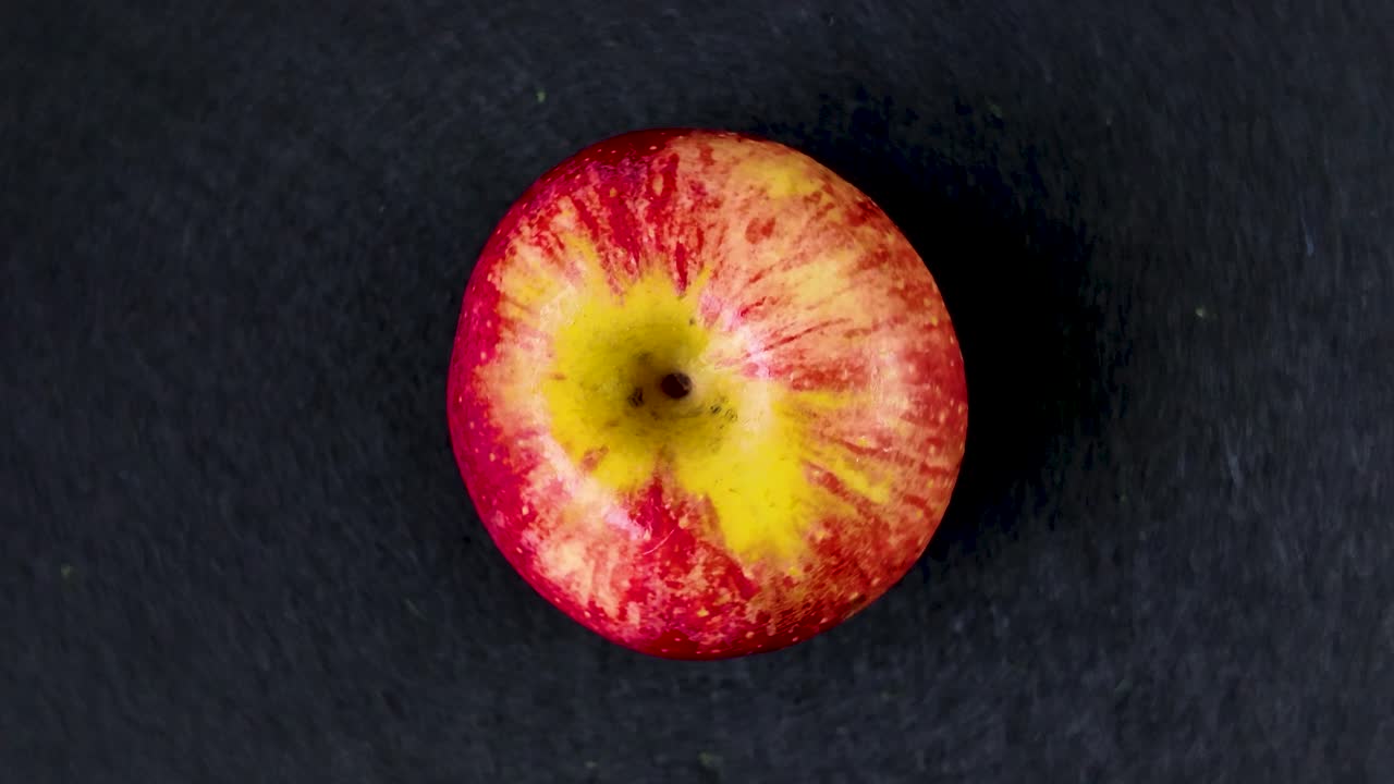 Close-up of juicy apple showing vibrant colors and textures, ideal for healthy eating and lifestyle themes