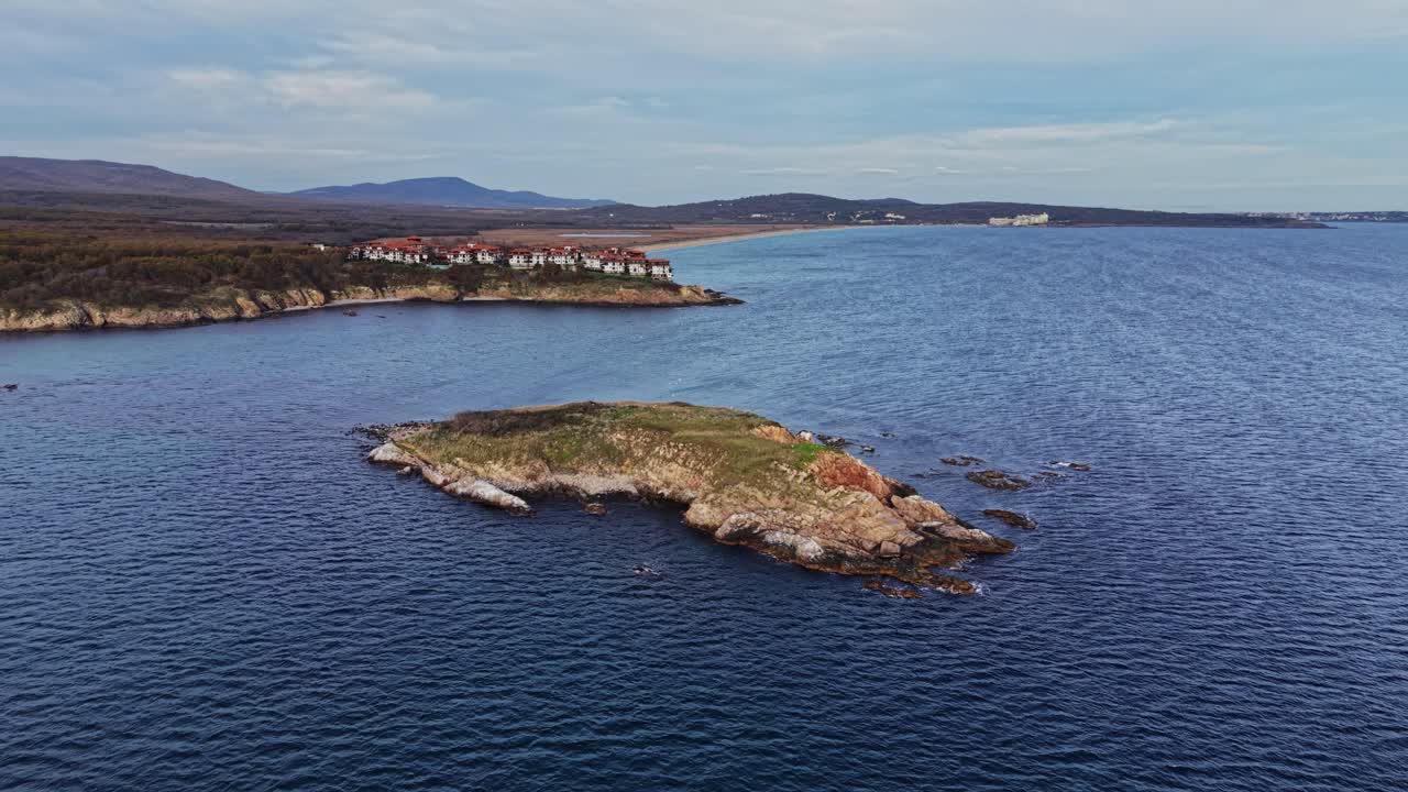 Stunning aerial view of a coastal landscape with green island and homes