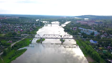 aerial view of a river and bridge in a small town