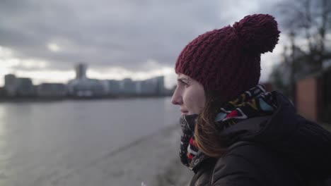 A-white-woman-is-looking-at-Thames-River-in-Greenwich-London-during-the-day