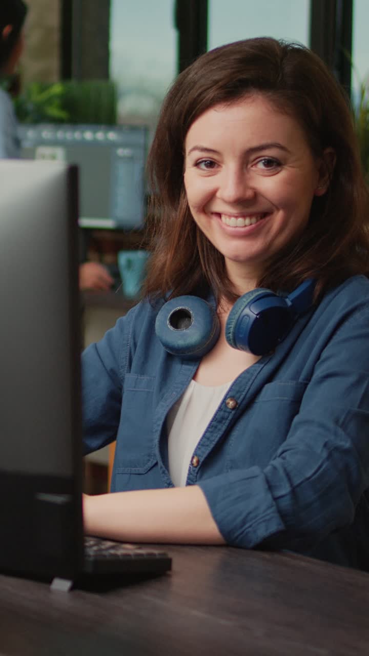 Vertical video: Friendly creative artist working with 3d industry interface