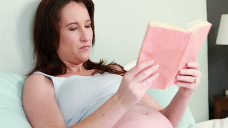 pregnant woman reading book