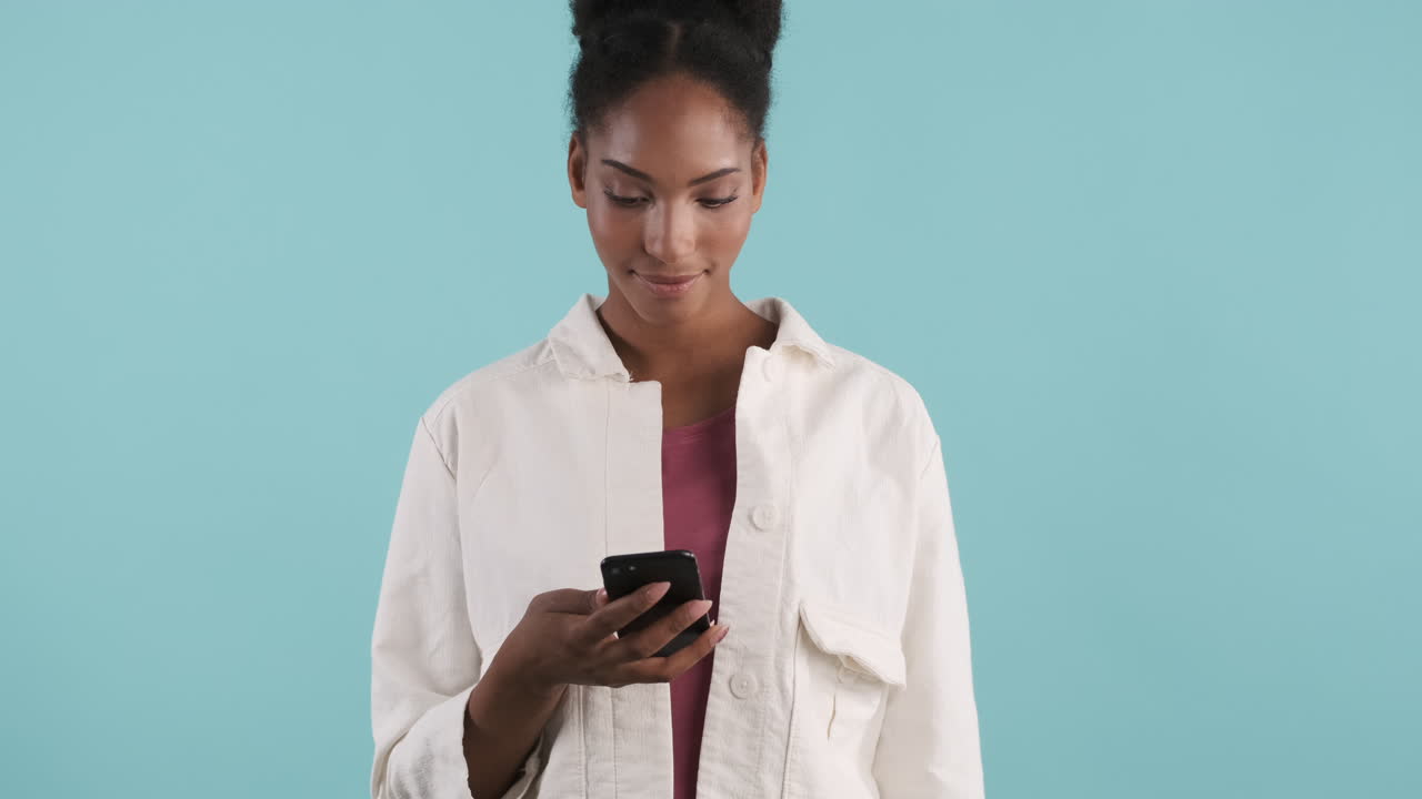 Happy girl with phone waving hand