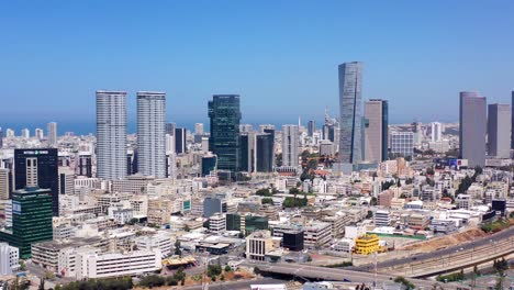 aerial view of tel aviv cityscape with modern skyscrapers and the mediterranean sea