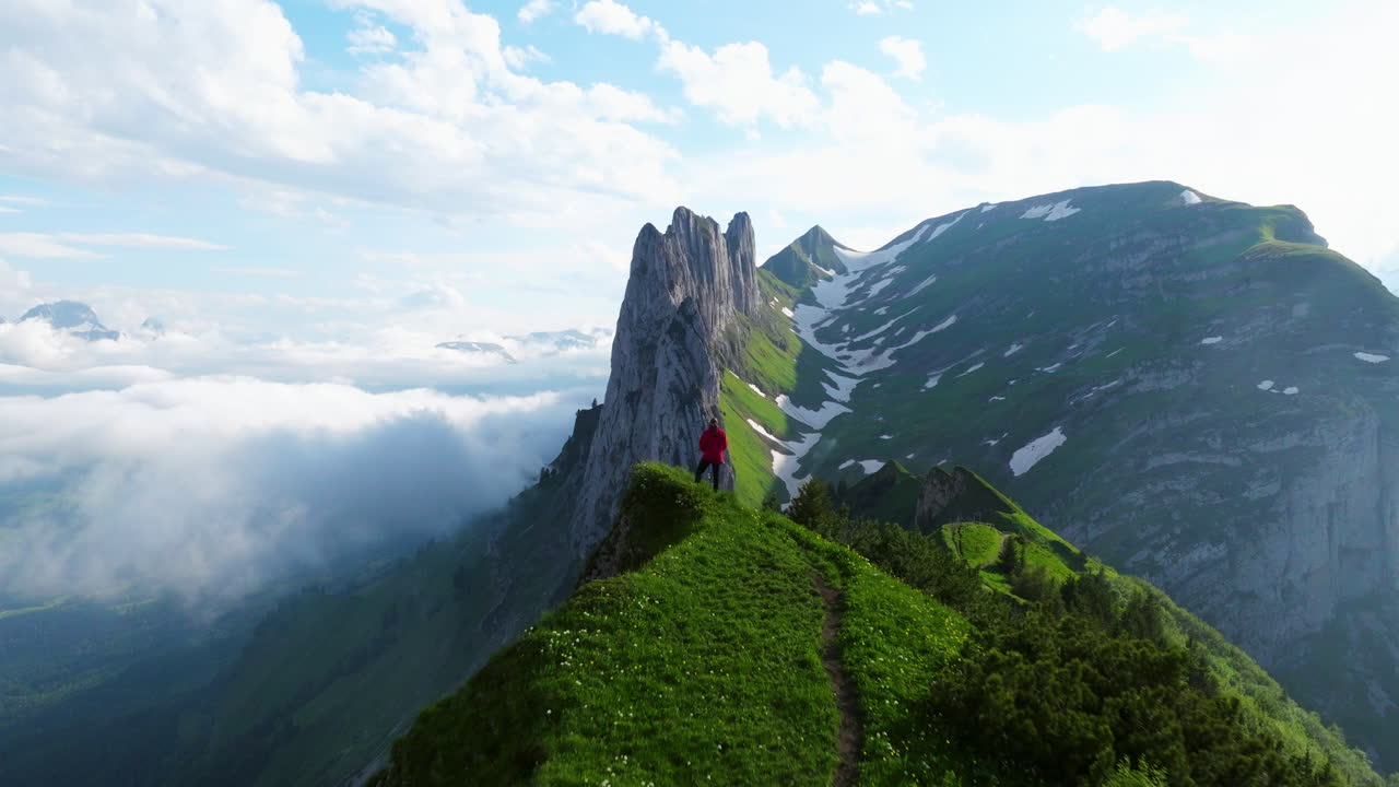 Hiker Over Saxer Lucke Viewpoint Near Appenzell In Switzerland. Aerial Pullback Shot
