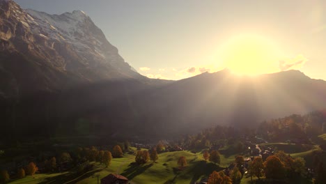 aerial drone footage pushing in over bodmi area in grindelwald with stunning view of eiger north face, switzerland