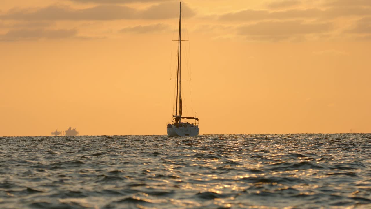 Anchored Sailboat in Caribbean Sea and Golden Horizon, Wide View, Full Frame
