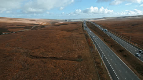 Cinematic-Aerial-footage-view-of-M62-Motorway,-Saddleworth,-Windy-Hill,-UK