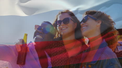 friends smiling and holding drinks, russian flag animation over beach background