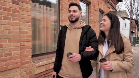 caucasian tourist couple walking through the city.