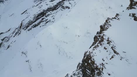 Beautiful-cinematic-aerial-of-snowy-alpine-mountain-glacier-peaks