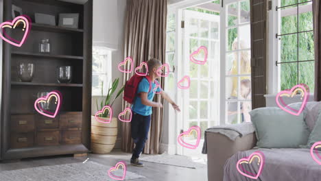 animation of hearts over happy caucasian boy and parents coming home after school