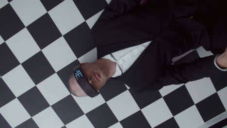 man in vr headset on chessboard floor